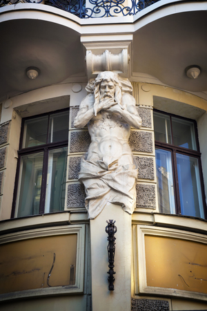 Architectural fragment of a sculptural bas-relief on the small street of the old city. Europe. Riga.の写真素材