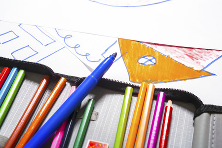 Colored marker pens painting on white paperの写真素材