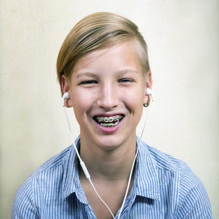 Teen with braces on his teeth. Orthodontics and bite correction.の写真素材
