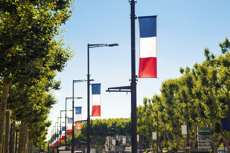 French flags along the road in Perpignan, Franceの写真素材