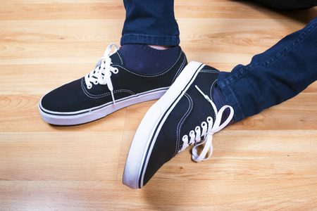 The black sports shoes. Modern teenage footwear.の写真素材