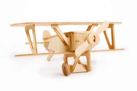 Wooden airplane model isolated over white backgroundの写真素材