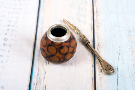 Yerba mate cup and straw on wooden backgroundの写真素材