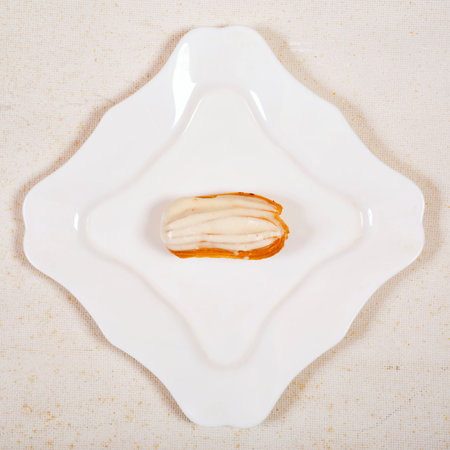 Eclair cake, on white plate  background.Top viewの写真素材