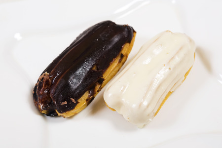 Eclair cakes, on white plate  background.Top viewの写真素材