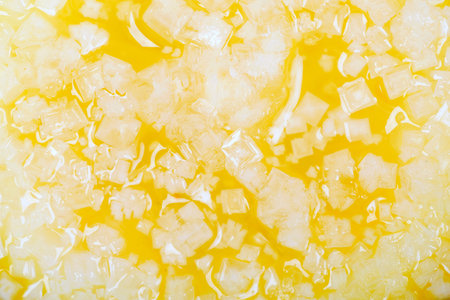 Crystallization of sugar in lemon juice macro backgroundの写真素材