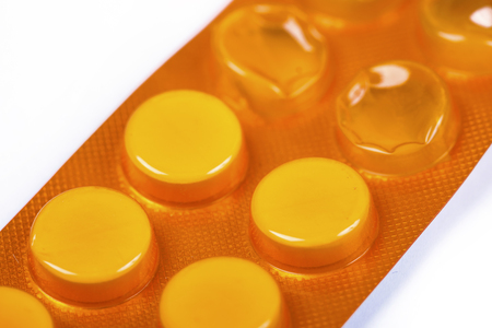 Macro photo many white small tablets in blister pack.の写真素材