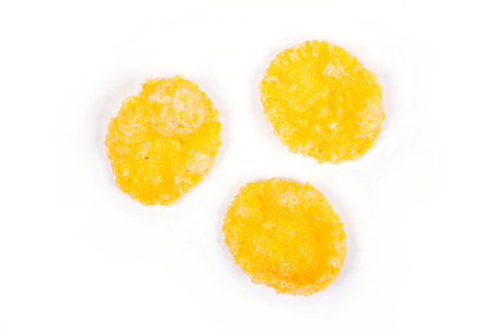 Corn flakes isolated on white background.Top view
