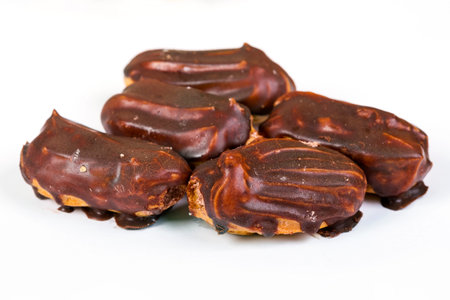 Eclair sweet cakes on white background. Top view