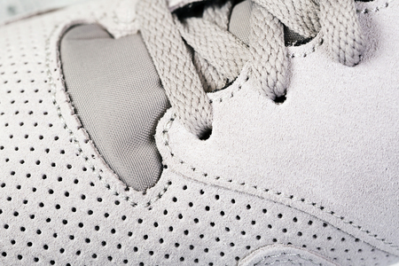Pair of men's sports shoes close up backgroundの写真素材