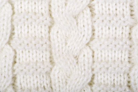White structure of a  knitted woolen fabric background    の写真素材