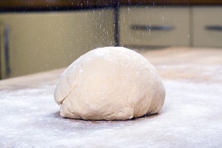 Fresh dough ready for baking on the wooden tableの写真素材