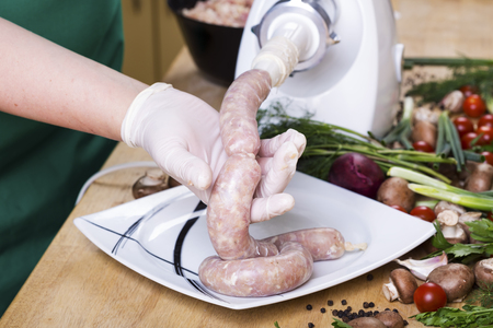 Making Sausage. Production of homamade sausage in kitchen.の写真素材