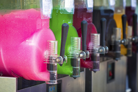 Mix flavors of grenadine ice for sale in summer in the barの写真素材