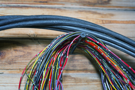 The bunch of electric wires or cables are strongly tangled together.の写真素材