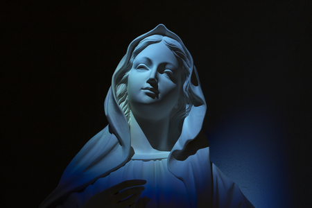 Virgin Mary our lady of grace on blue lightの写真素材