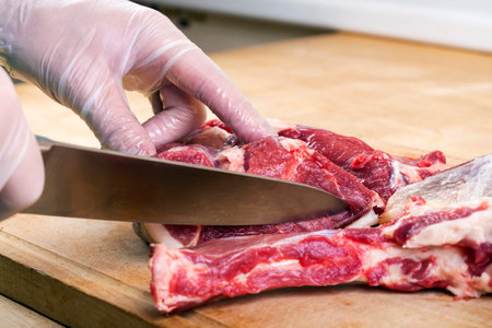 Separation of a raw mutton meat with rib for meat portions
