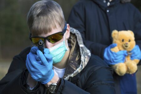 Teens in protective sterile medical mask.Air pollution, virus,  pandemic coronavirus concept.の写真素材