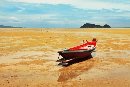 Seascape in Thailand with fisherman boat during low tide.の写真素材