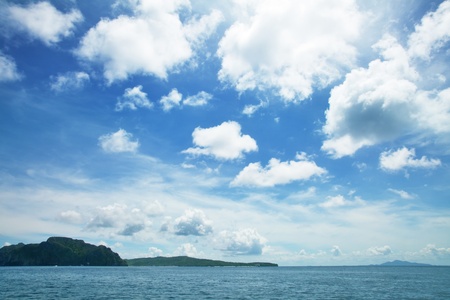 Blue sky with white clouds over seaの写真素材