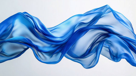 Blue silk floating fabric on a white background.の素材