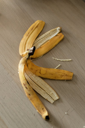 Banana peel on a wooden background, close-up, selective focusの写真素材