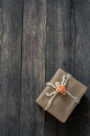 Gift box on wooden background. Top view with copy space.の写真素材