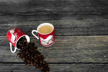 Coffee cup and coffee beans on wooden background. Coffee breakの写真素材