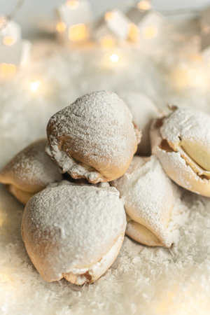 Homemade cookies in powdered sugar on a light background. Selective focus.の写真素材