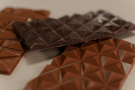 Close up of chocolate bars on white background. Selective focus.