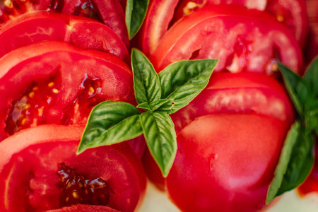 Tomato salad with basil and mozzarella cheese. Close up.の写真素材