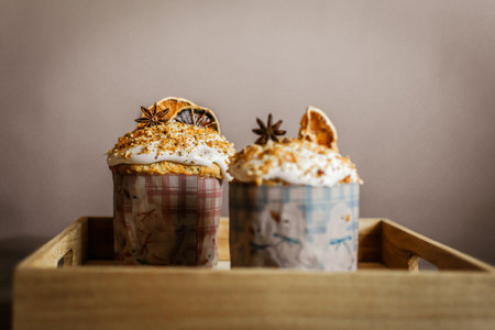 Cupcake with whipped cream and cinnamon in a wooden box.の写真素材