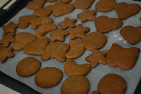 Homemade gingerbread cookies on a baking sheet. Selective focus.の写真素材