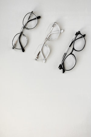 Eyeglasses on white background. Flat lay, top view.の写真素材