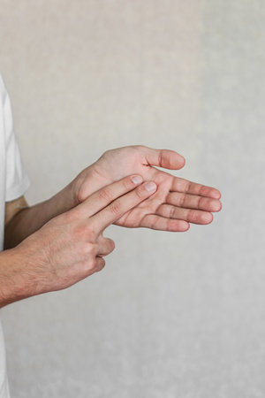 a young man shows gestures of the deaf and dumb. the language of people with disabilities. sign languageの写真素材