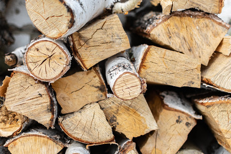 Pile of firewood in winter, close-up view.の写真素材