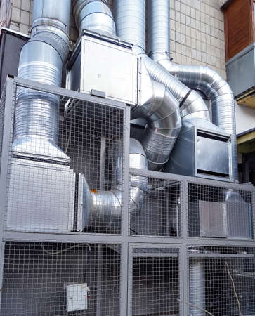 Outdoor system of industrial ventilation pipes. Air duct and air conditioning system. Fresh air supply. Ventilation of the kitchen, restaurant. Professional equipment.の写真素材