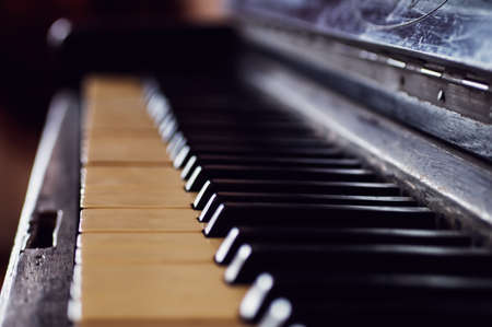 Old black piano, keys close-up, vintage musical instrument. Beautiful Blur, Selected Focusの写真素材