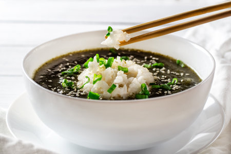 orean seaweed cream soup with boiled rice in a white bowl. birthday soup. Traditional Korean Cuisine. healthy diet. Pregnancy. custom. close up.の写真素材