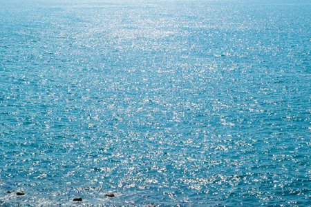 Blue sea. Sunny day. Sun glare on the water. Marine background. Beautiful seascape.の写真素材