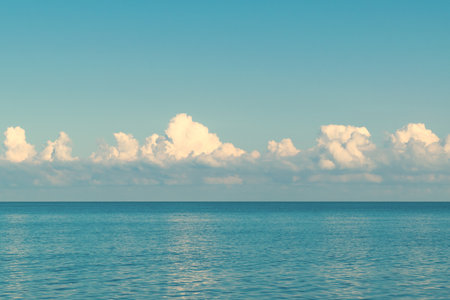Blue sea, blue sky and white clouds. Beautiful seascape. Marine background. Quietness and tranquility. Holidays at sea.の写真素材