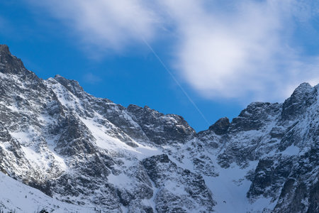 Snowy mountain peaks. Beautiful winter landscape in the mountains. Stone cliffs.の写真素材