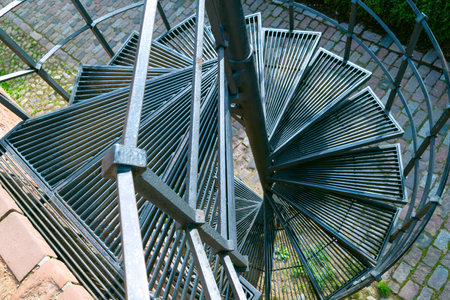 Spiral metal staircase outside the building. Details and elements of architecture.の写真素材