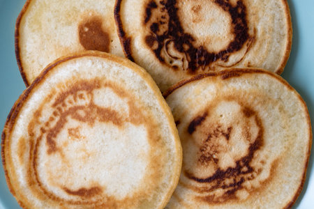 Pancakes on a plate, close-up. Four pancakes for breakfast. Tasty food.の写真素材