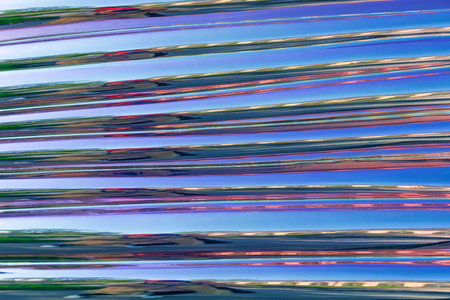 Shiny reflective surface with stripes. Beautiful unusual background. Glossy surface.