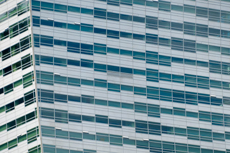 Multi-storey building in the city center. Business center, office. Modern architecture. Details of a...