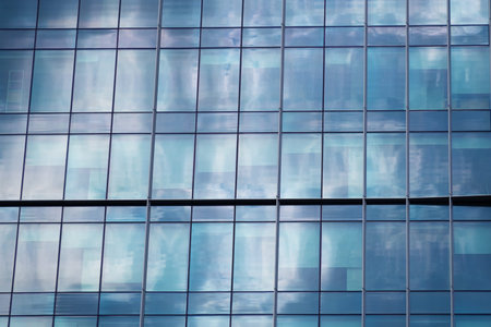 Multi-storey building in the city center. Business center, office. Modern architecture. Details of a...