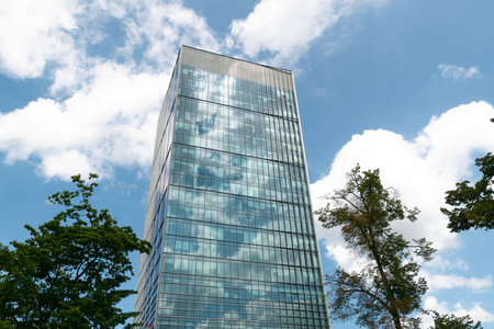 Tall modern building against blue sky. Office building in city center. Business center.の写真素材