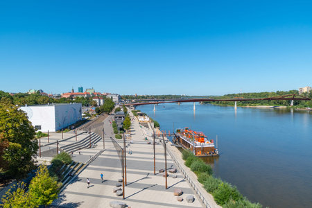 View of Vistula Boulevards, the Vistula and the pedestrian bridge. Clear sunny day. Warsaw, Poland....