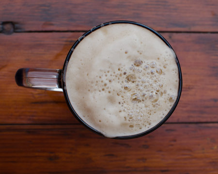 The mug of beer with foam. View from above.の写真素材